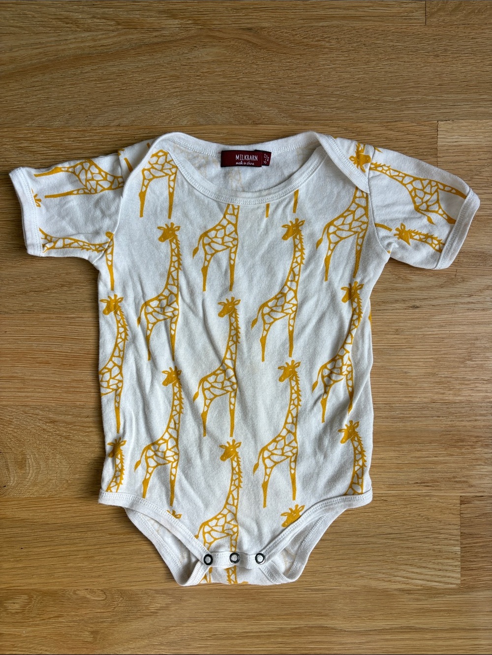 MILKBARN | Organic Cotton Giraffe Print One-Piece in Mustard